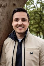 AI generated headshot photograph of a man wearing a jacket in the forest